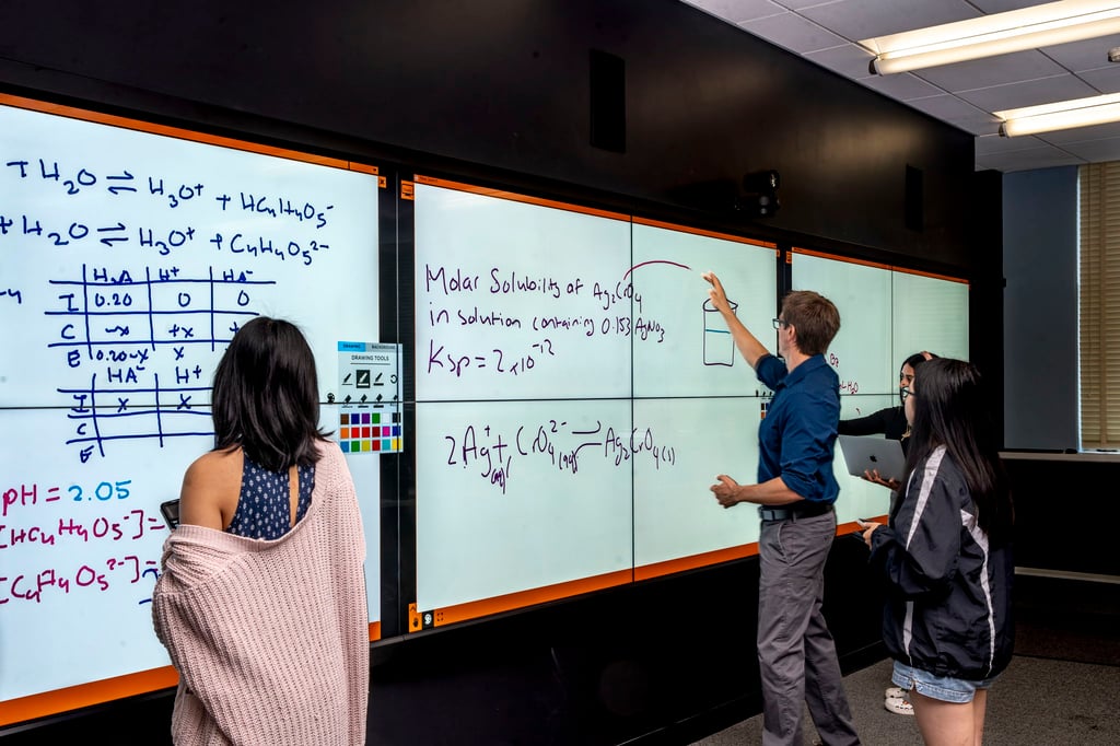 t1v-university-of-california-riverside-excite-center-for-teaching-and-learning-thinkhub-visual-collaboration-software-on-planar-6x2-video-wall-teacher-using-board-office-hours